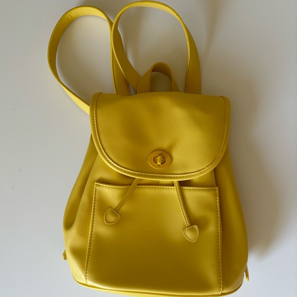 Urban Outfitters Handbags - Urban Outfitters Mini Pleather Backpack in Yellow